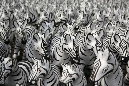 Plenty of small zebra statues in Thai temple