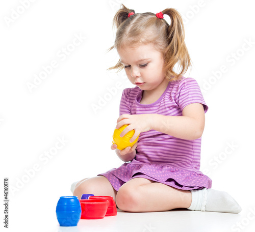 Cute child girl playing wit...