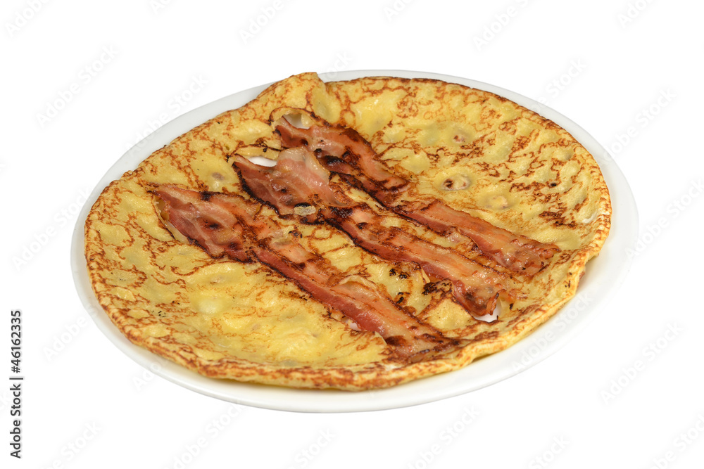 A board with a pancake with bacon strips on a white background.