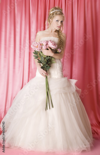 beautiful bride on pink background