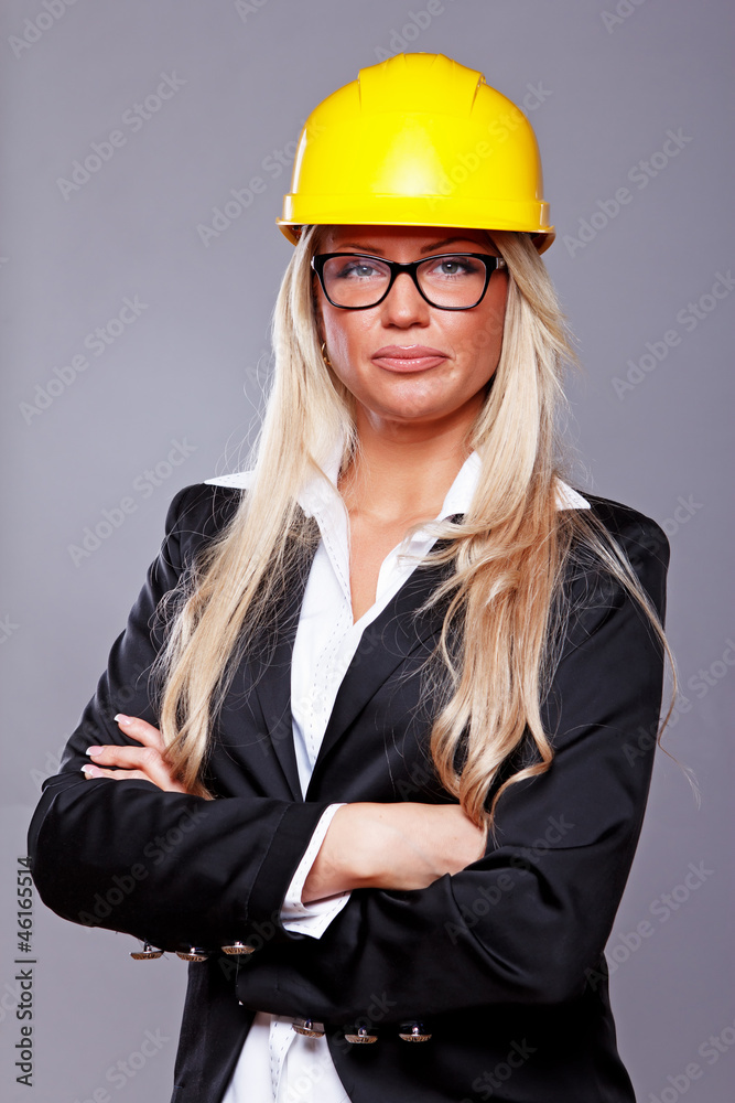 Portrait of beautiful girl posing in studio in helmet Portrait of beautiful girl posing in studio in helmet