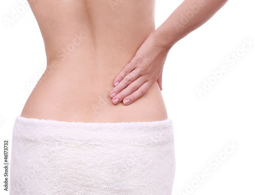 woman with pain in her lower back isolated , backache