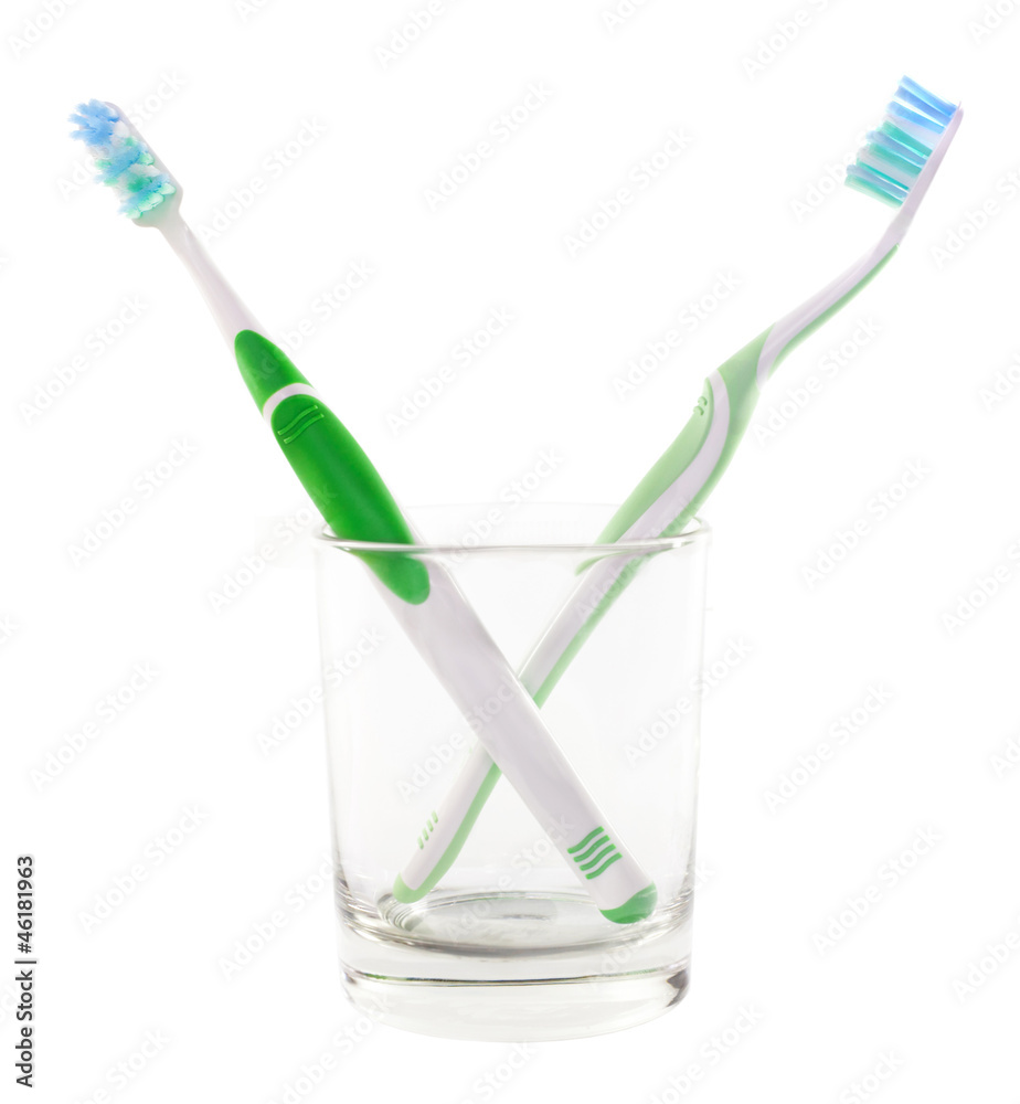Two green toothbrushes Two green toothbrushes