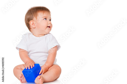 Little boy with a blue toy blocks, isolated on white
