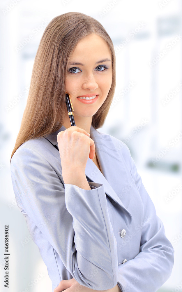 The beautiful business woman in the office The beautiful business woman in the office