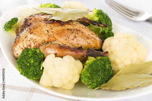 Roast Dinner - Roast partridge with cauliflower and broccoli. photo