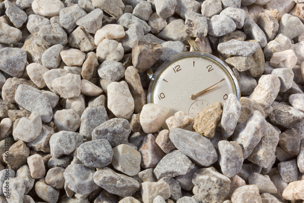 Old Watch Emerging from the Gravel Old Watch Emerging from the Gravel