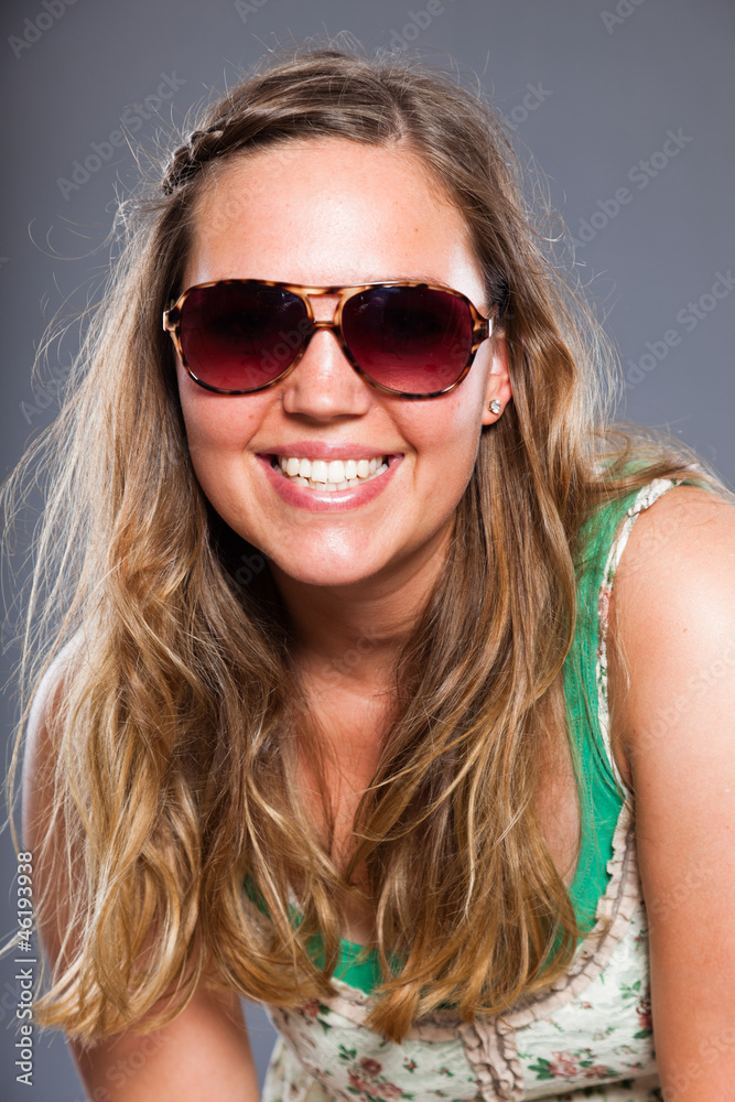 Pretty woman with long brown hair and sunglasses. Isolated. Pretty woman with long brown hair and sunglasses. Isolated.