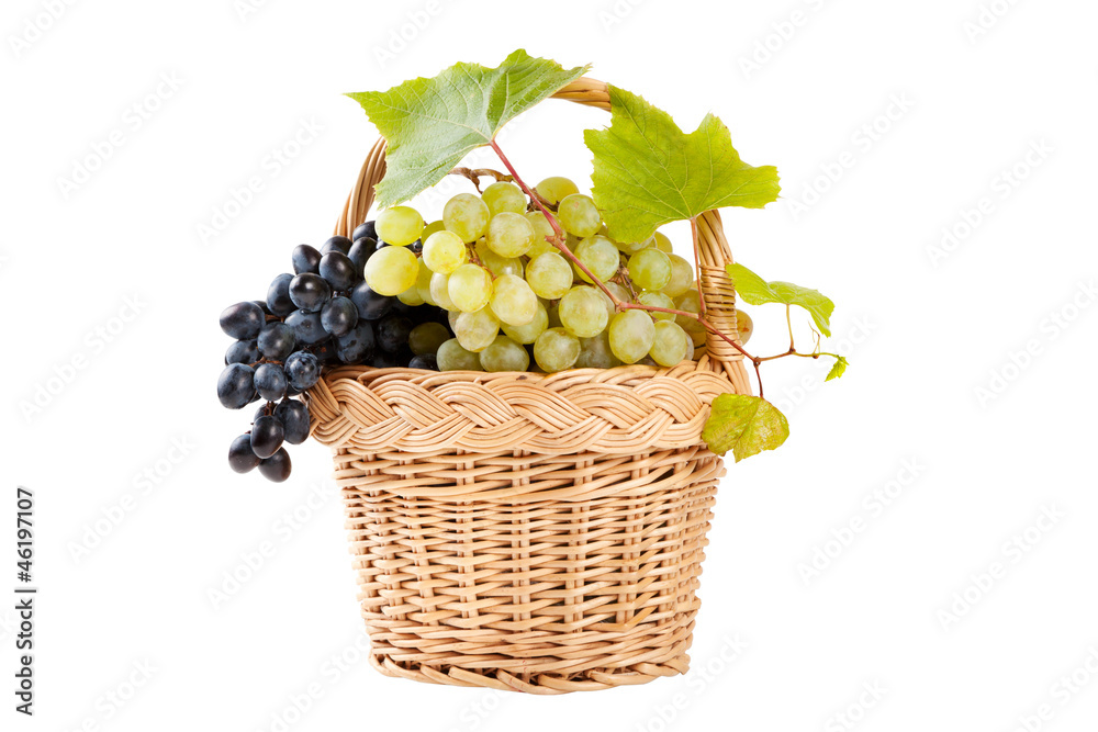 grapes in basket with vine leaves isolated on white grapes in basket with vine leaves isolated on white
