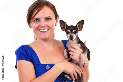 Portrait of a young woman holding her chihuahua dog