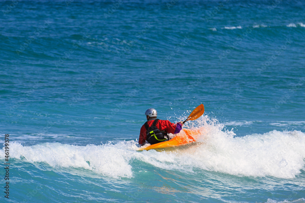 Man paddling a Sea kayak