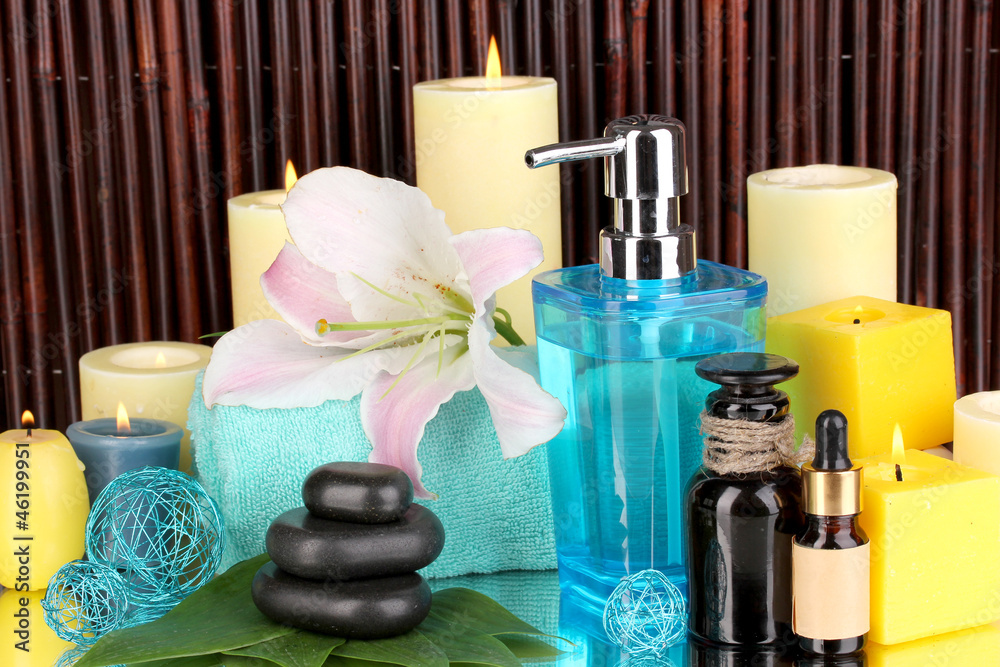 Beautiful spa setting on bamboo background with reflection Beautiful spa setting on bamboo background with reflection