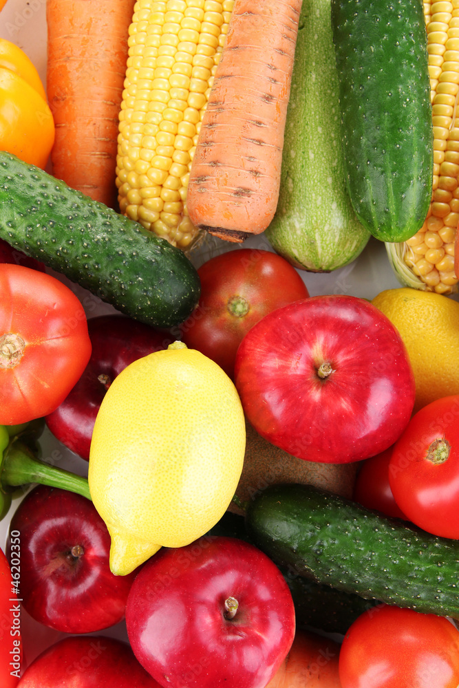 Assortment of fresh vegetables and fruits as a background Assortment of fresh vegetables and fruits as a background