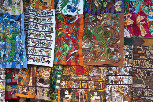 Colorful materials - market in Chichicastenango photo