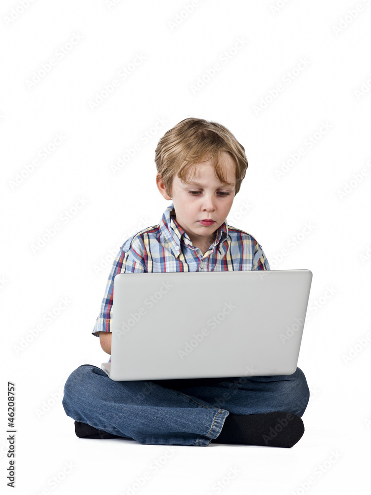 front view of a elementary boy using laptop front view of a elementary boy using laptop