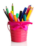 Colorful pencils and felt-tip pens in pink pail isolated