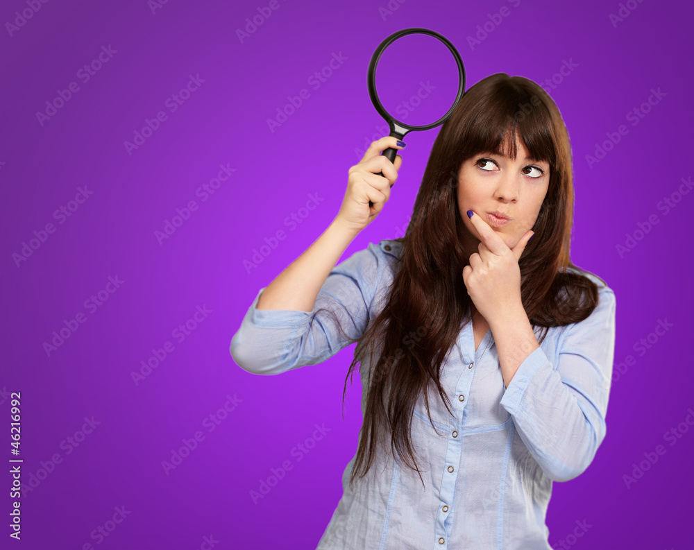 Portrait Of A Girl Holding A Magnifying Glass And Thinking Portrait Of A Girl Holding A Magnifying Glass And Thinking