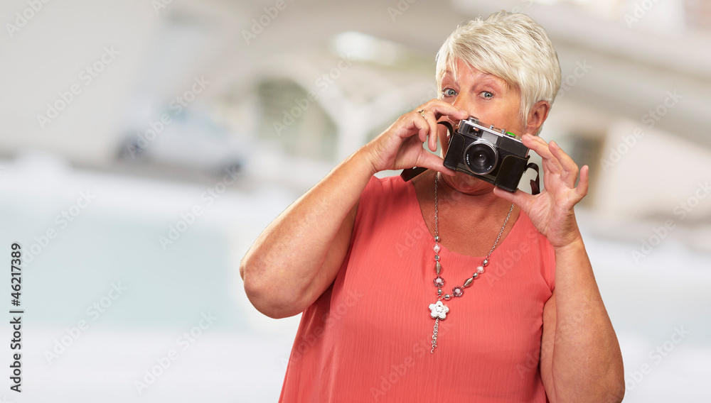 Senior Woman Holding Camera