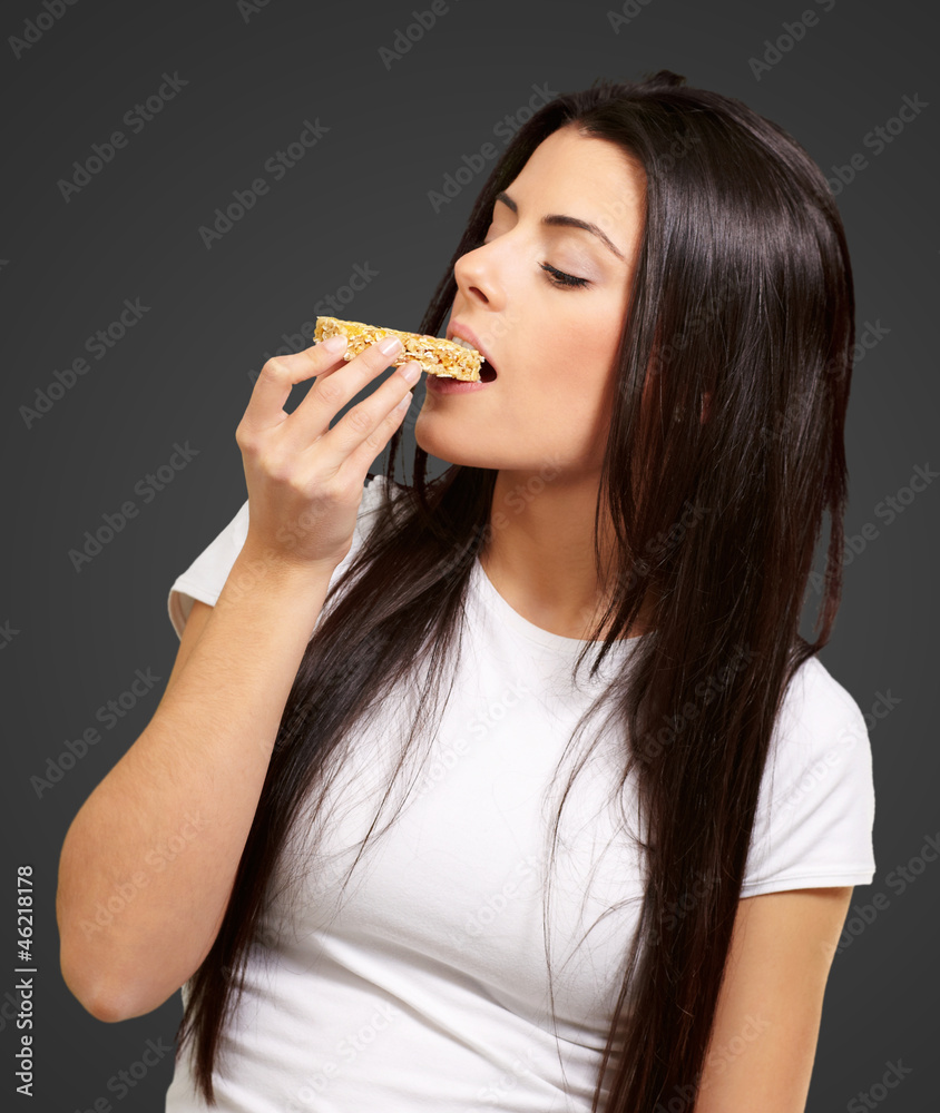 Young Girl Eating Cereal Bar