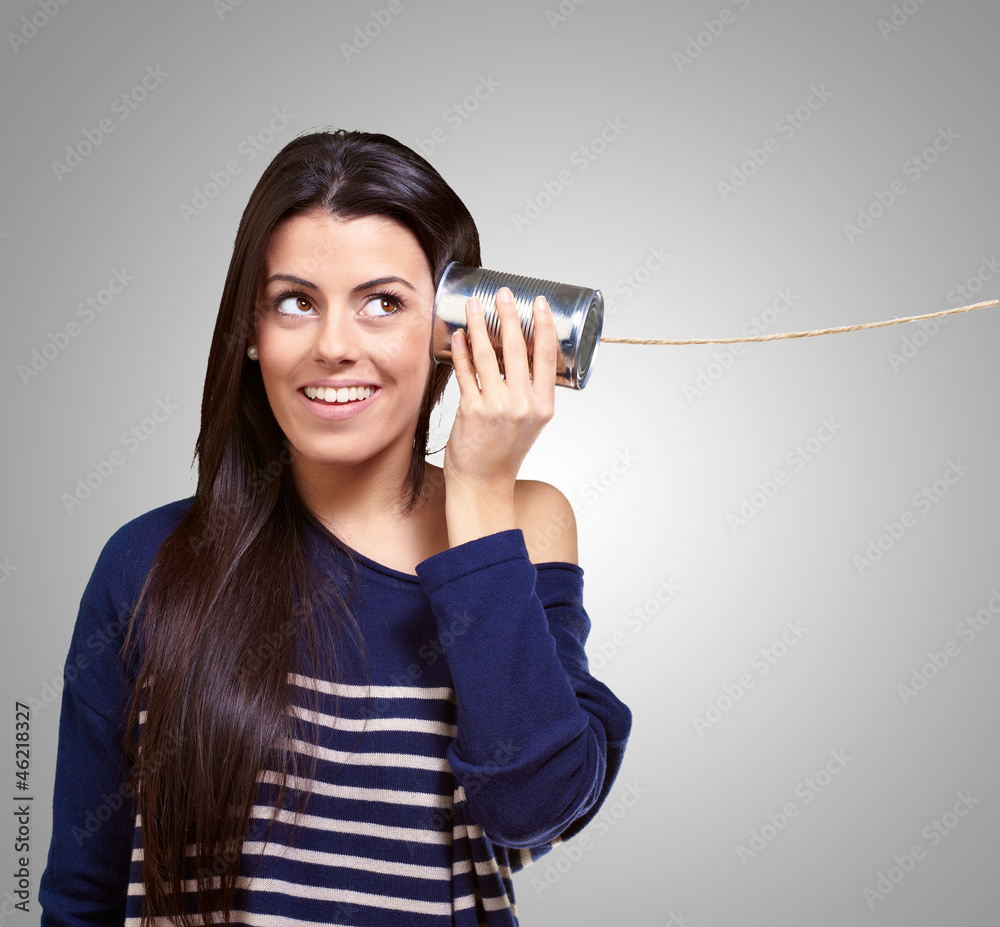 Female Holding A Metal Tin As A Telephone Female Holding A Metal Tin As A Telephone