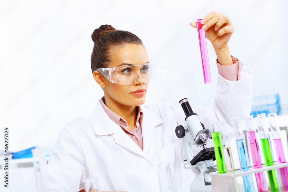 Young female scientist working in laboratory Young female scientist working in laboratory