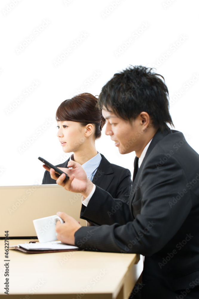 Young asian smiling business woman and businessman Young asian smiling business woman and businessman