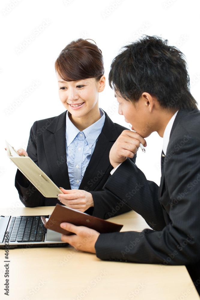 Young asian smiling business woman and businessman Young asian smiling business woman and businessman