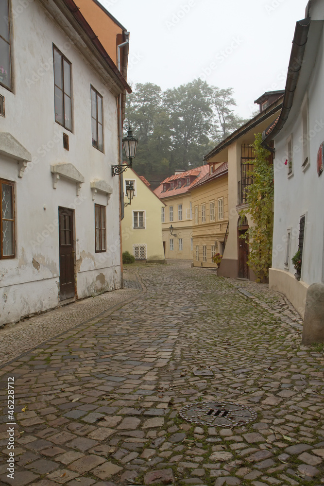 Foggy morning in an old streets of Prague.