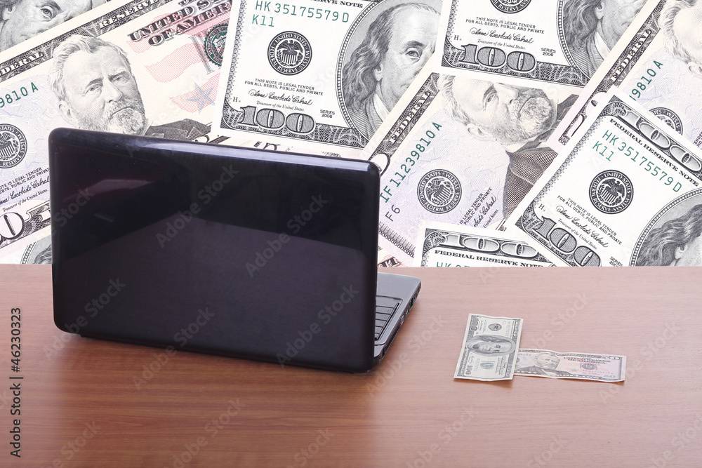money flying and pouring out from a notebook computer money flying and pouring out from a notebook computer