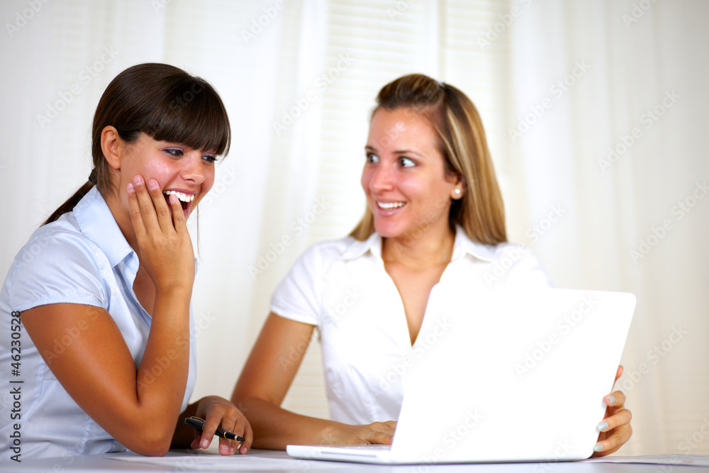 Surprised adult businesswomen working together Surprised adult businesswomen working together