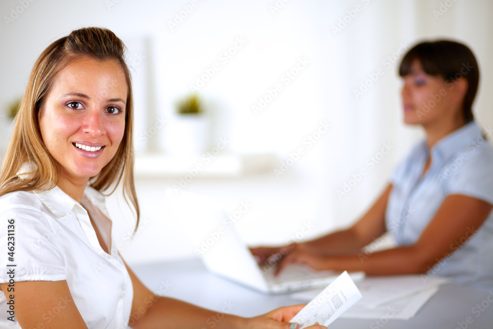 Fototapeta premium Caucasian businesswoman smiling and looking at you