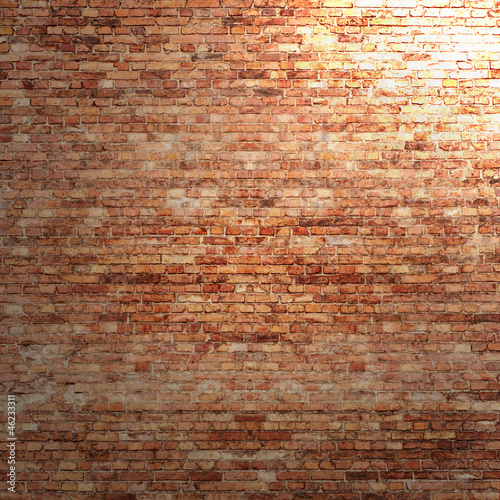 red brick wall texture background with spotlight