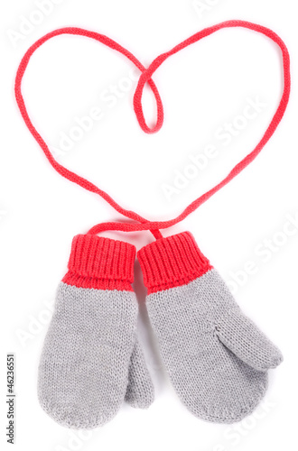 pair of gray baby mittens on a string in the form of heart