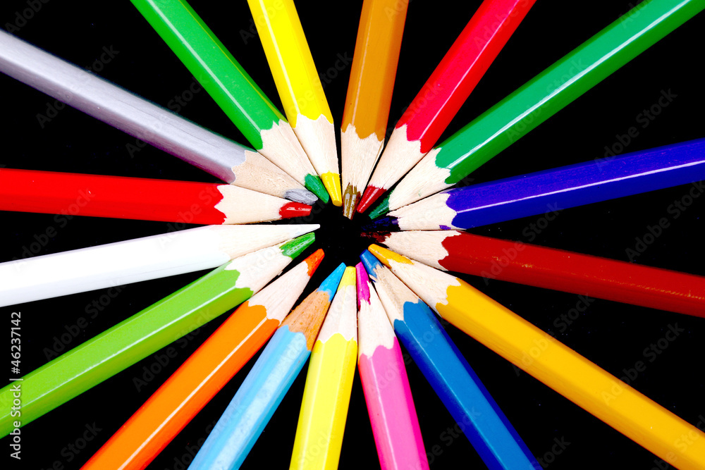Assortment of coloured pencils with shadow on white/back backgro Assortment of coloured pencils with shadow on white/back backgro