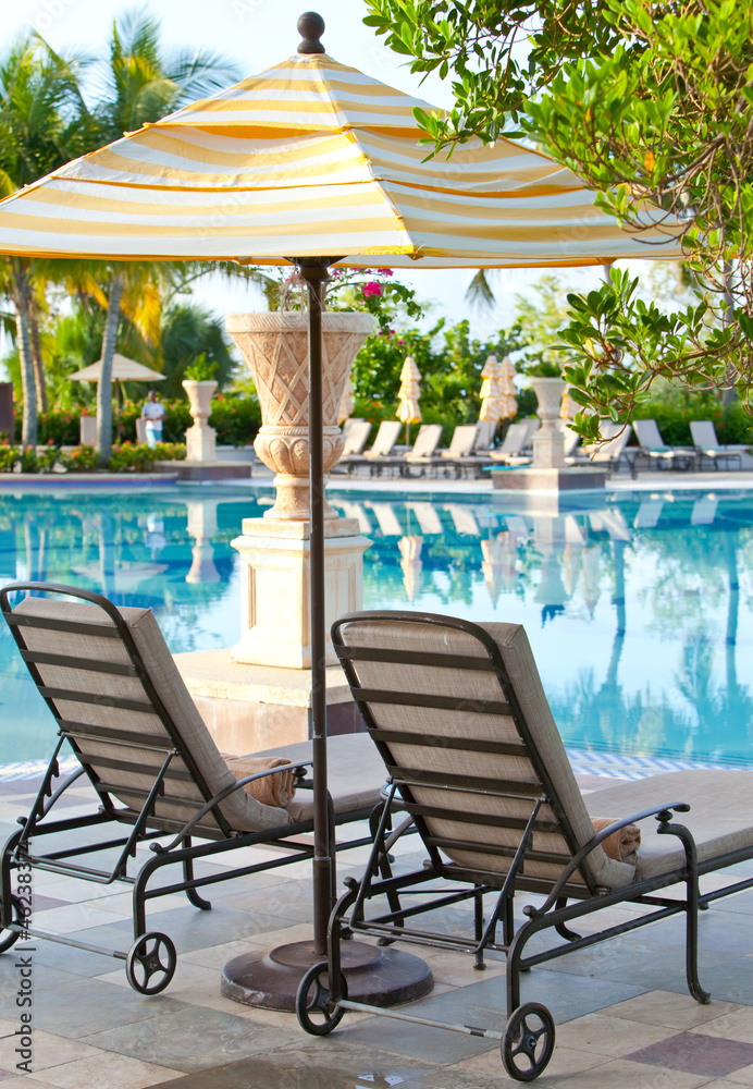 chaise lounges near  pool..
