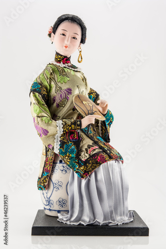 Chinese doll with fan on white