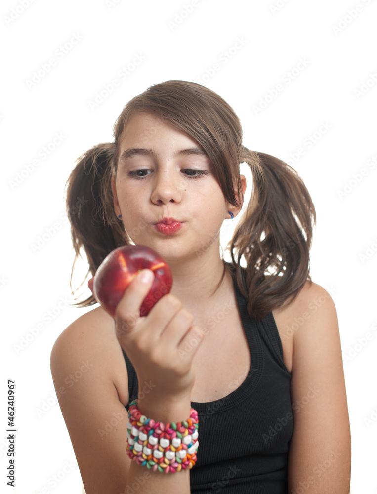 Beautiful and young teenage girl in black t-shirt eating a peach Beautiful and young teenage girl in black t-shirt eating a peach