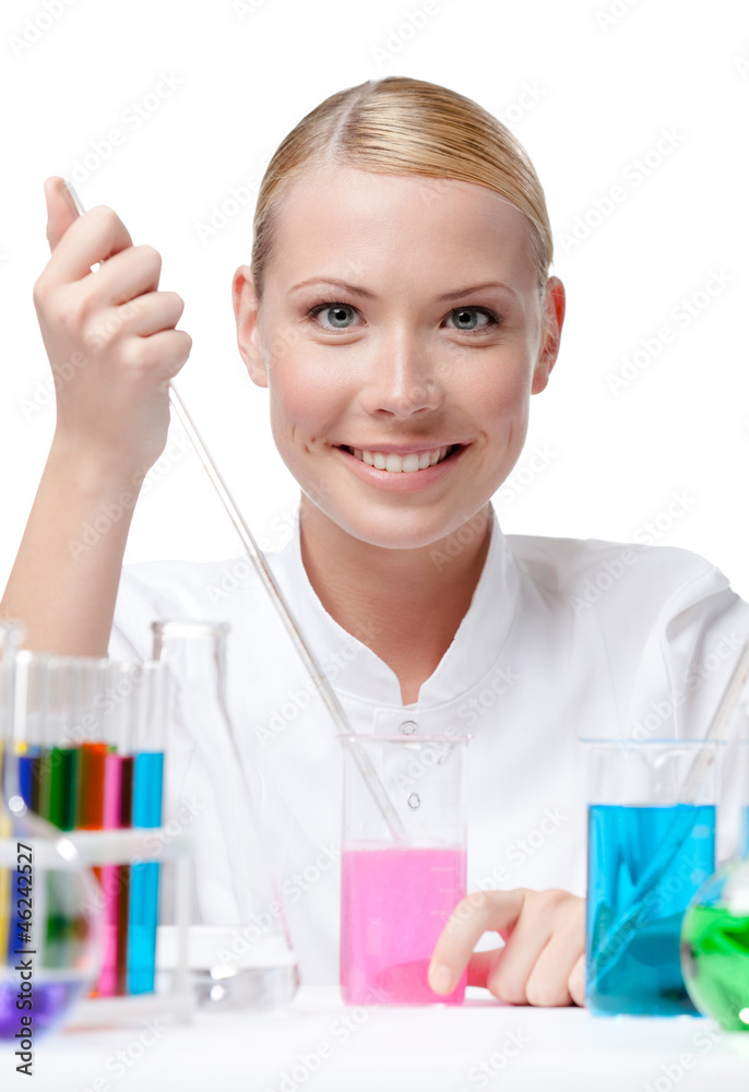 Female scientist is surrounded by medical vials and flasks Female scientist is surrounded by medical vials and flasks