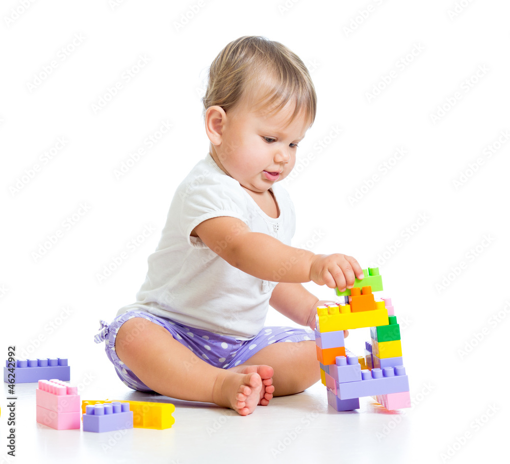 little cheerful child with construction set over white backgroun little cheerful child with construction set over white backgroun