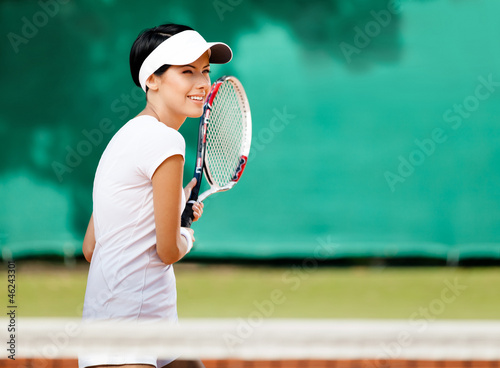 Sportswoman at the tennis court with racquet. Leisure © Karramba Production
