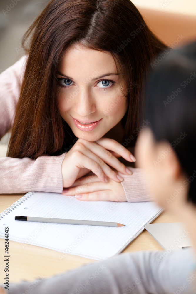 Close up of woman with hands under her head Close up of woman with hands under her head