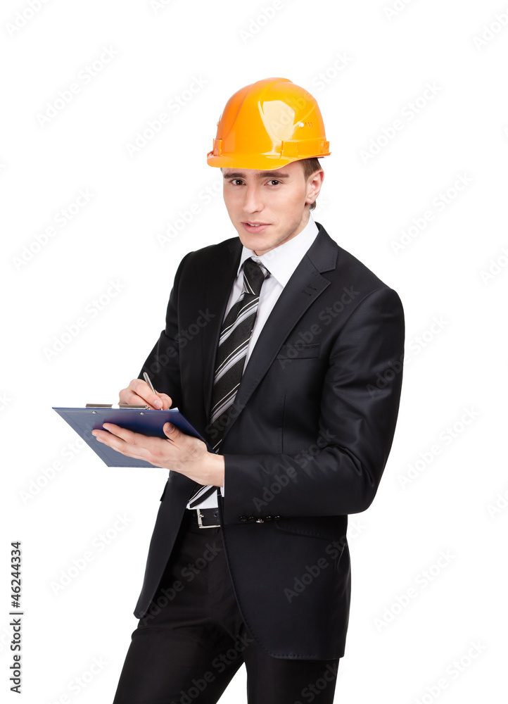 Making notes man in orange headpiece and suit, isolated on white Making notes man in orange headpiece and suit, isolated on white