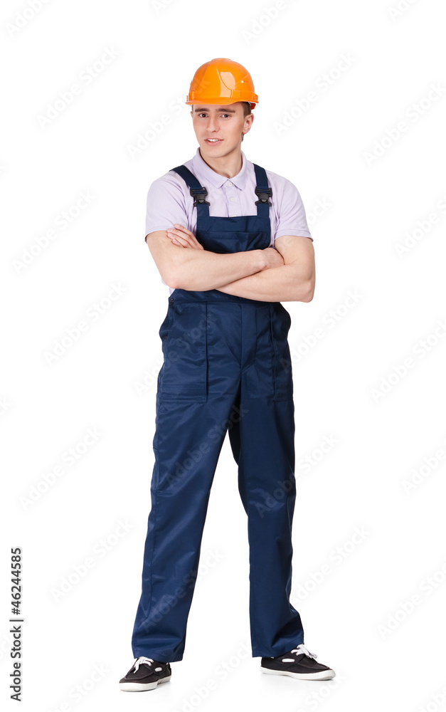 Full length portrait of foreman in overalls and orange hard hat Full length portrait of foreman in overalls and orange hard hat