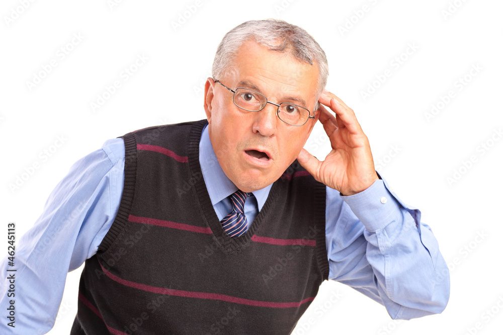 Mature man holding his head and gesturing what Mature man holding his head and gesturing what