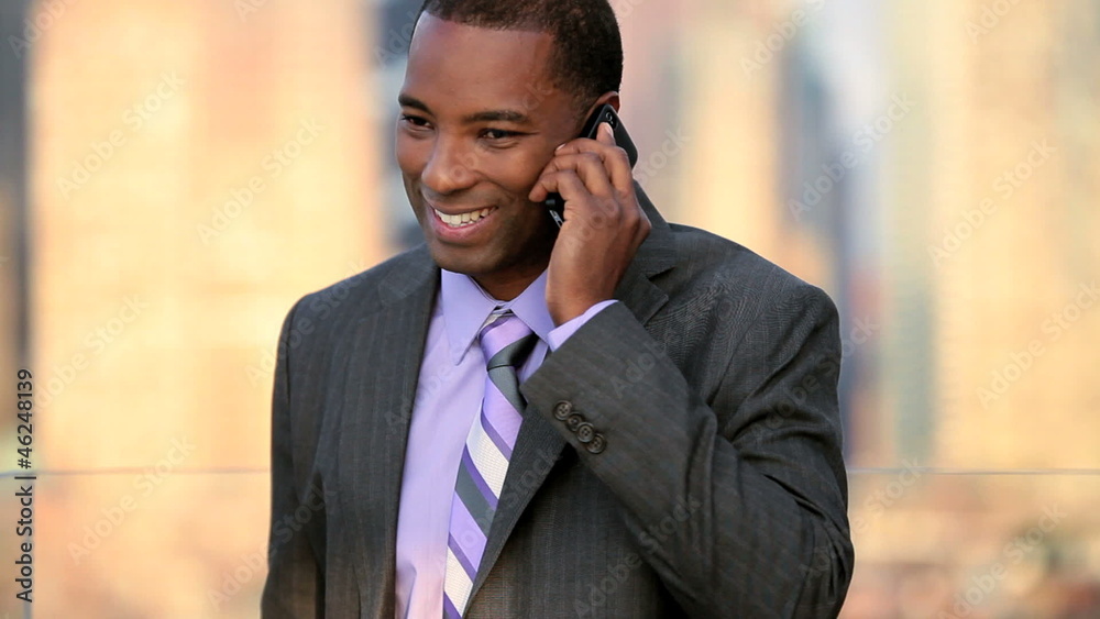 African American businessman has successful call on smart phone