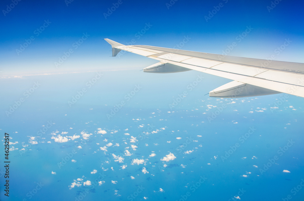 Airplane wing out of window Airplane wing out of window