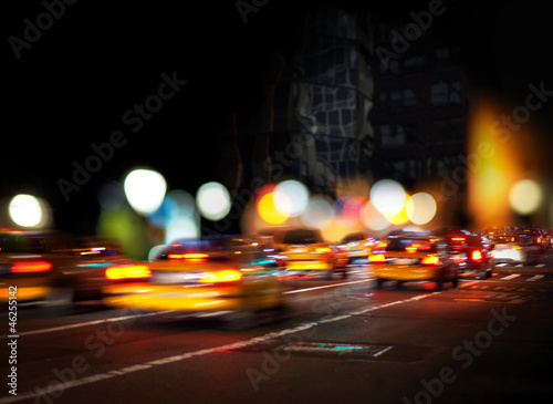 Fototapet Blurred yellow cabs
