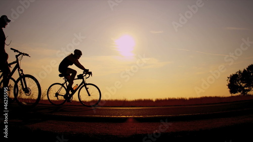 Wallpaper Mural Sunrise silhouette group of cyclist  Torontodigital.ca