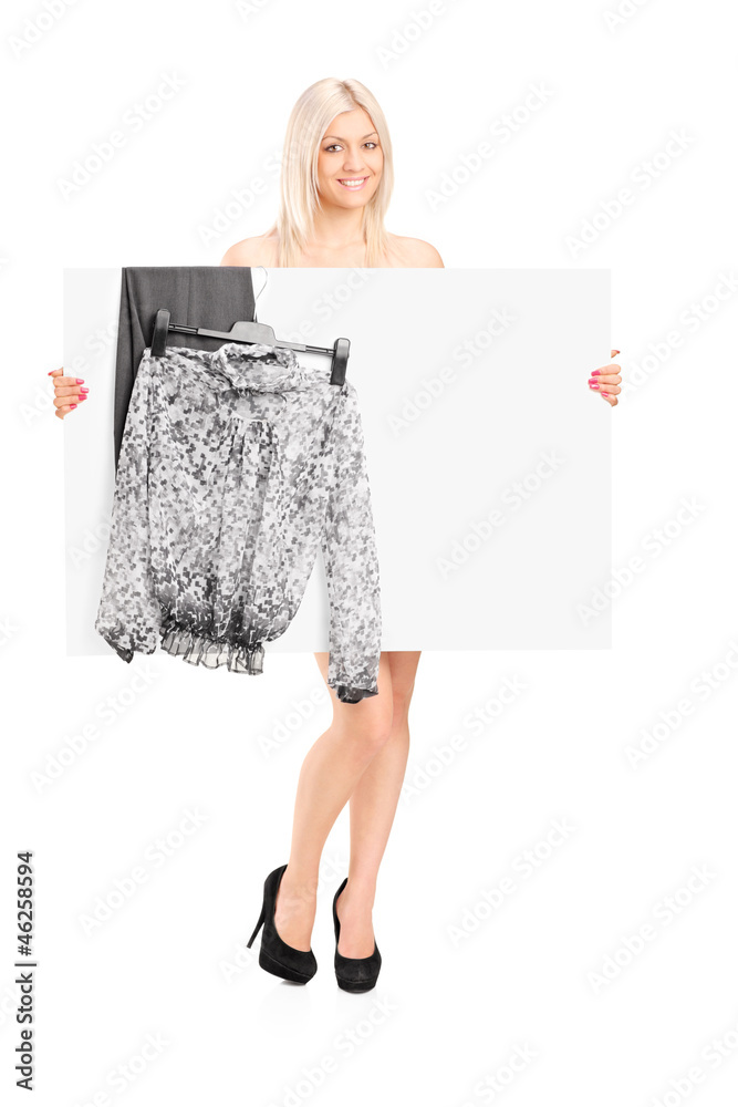 Blond woman dressing up, behind dressing panel Blond woman dressing up, behind dressing panel