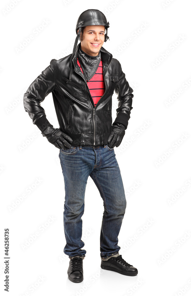 Full length portrait of a motorcycler with helmet posing Full length portrait of a motorcycler with helmet posing